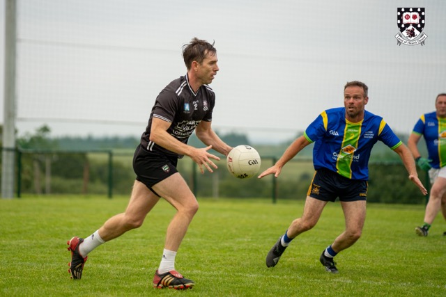 Masters players contesting the ball